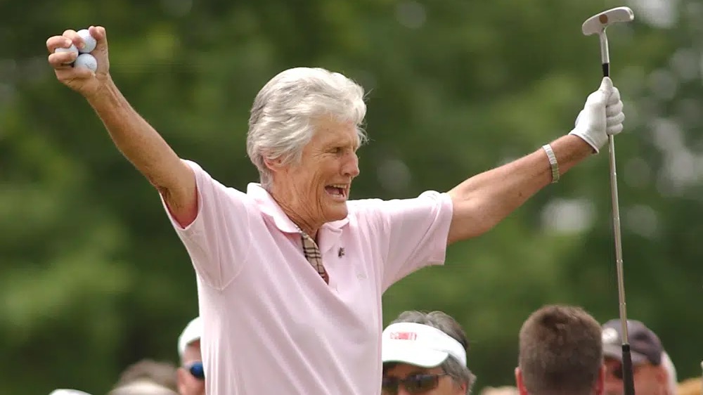 Kathy Whitworth responds to the crowd as she prepares to tee off during the Tournament of Champions golf tournament at Locust Hill Country Club in Pittsford, U.S., June 20, 2006. /AP