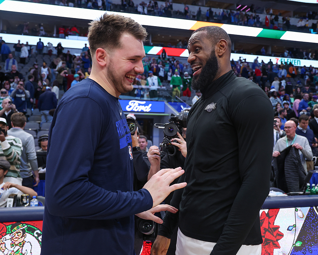 LeBron James (R) of the Los Angeles Lakers and Luka Doncic of the Dallas Mavericks smile after their NBA game at the American Airlines Center in Dallas, U.S., December 25, 2022. /CFP