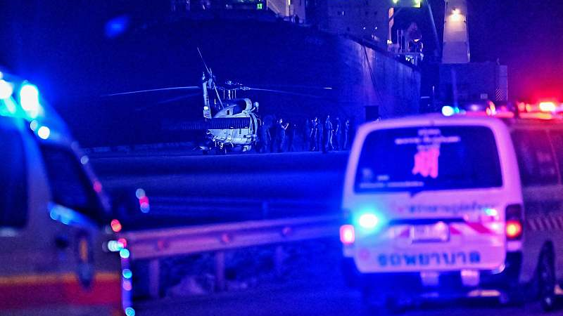 Ambulances speed towards a helicopter carrying the bodies of deceased sailors during the search for survivors of the capsizing of the Thai naval vessel HTMS Sukhothai, at Bang Saphan Pier in Prachuap Khiri Khan district, December 20, 2022. /CFP