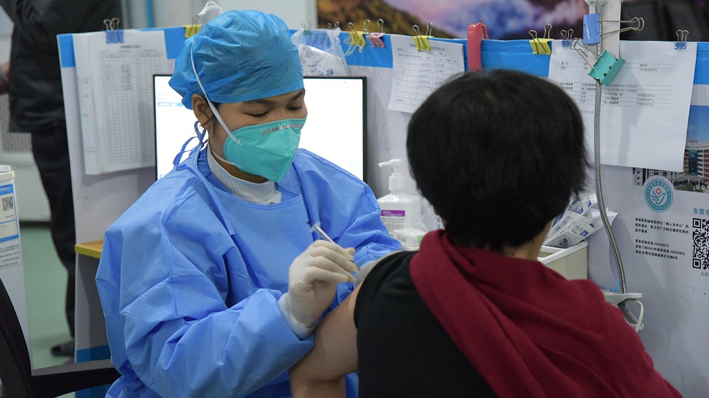 A resident receives COVID-19 vaccine in Dongguan City, south China's Guangdong Province, December 19, 2022. /CFP