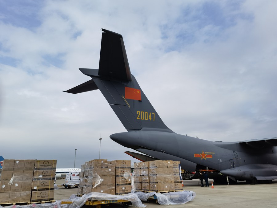 Disaster relief materials are loaded onto two Chinese Air Force transport aircraft headed for Tonga at the Guangzhou Baiyun International Airport in Guangzhou, south China's Guangdong Province, January 26, 2022. /Xinhua