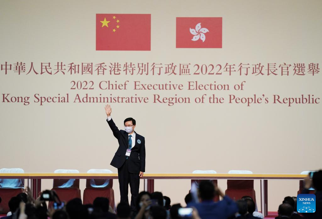 John Lee waves to people at the Hong Kong Convention and Exhibition Center in Hong Kong, south China, May 8, 2022. /Xinhua