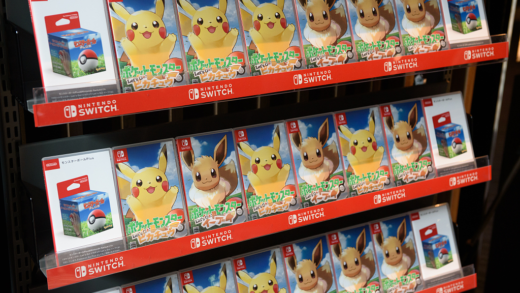 Packages of Pokemon: Lets Go Pikachu and Pokemon: Lets Go Eevee are displayed at a Pokemon Co. unveiling news conference in Tokyo, Japan, on May 30, 2018. /CFP