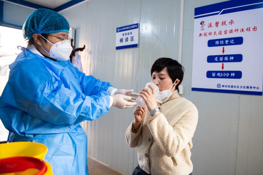 A resident receives a dose of inhalable COVID-19 vaccine at a community health service center in Tianxin District of Changsha, central China's Hunan Province, December 22, 2022. /Xinhua