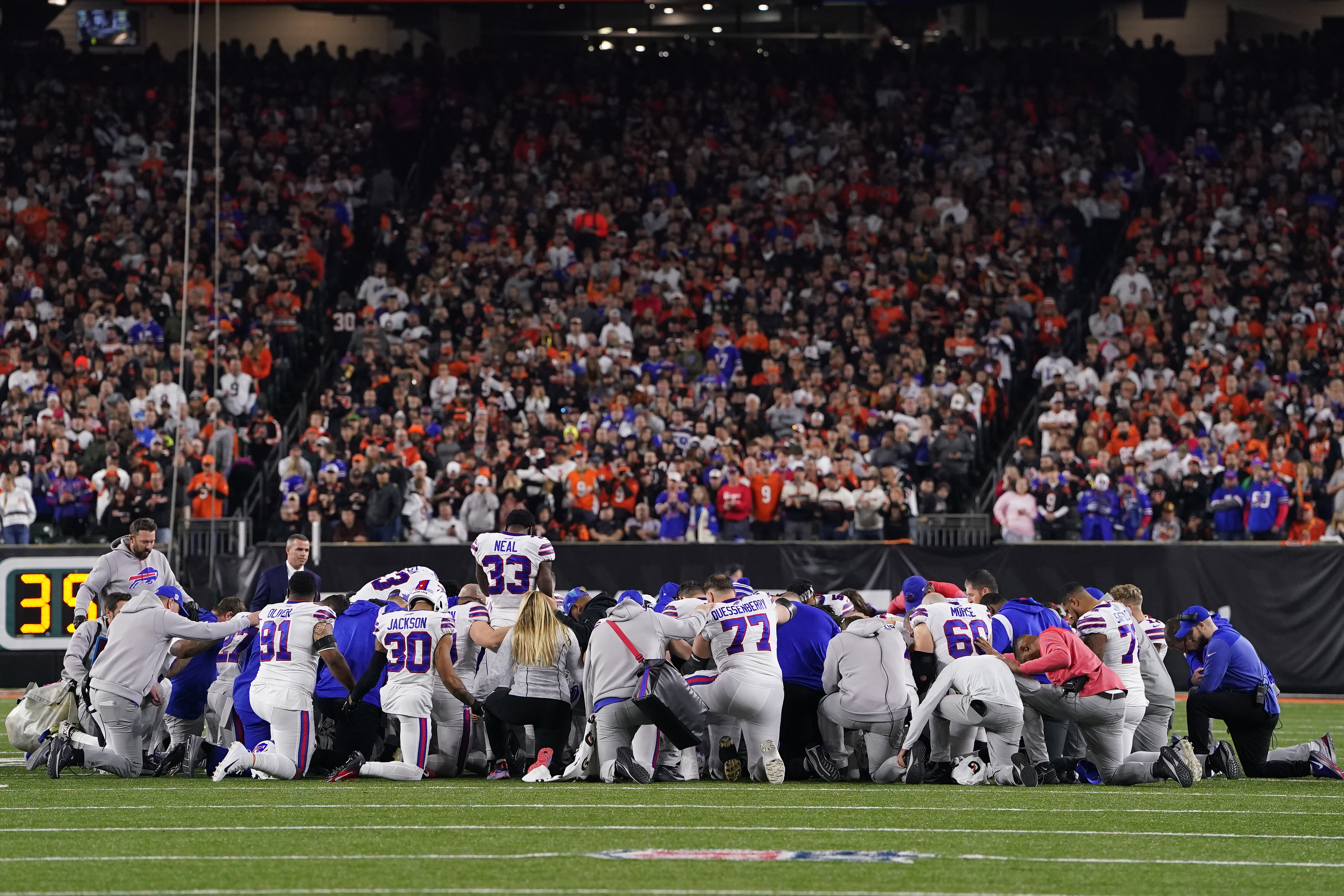 Players of the Buffalo Bills pray for their safety Damar Hamlin, who collapsed in the game against the Cincinnati Bengals at the Paycor Stadium in Cincinnati, Ohio, January 2, 2023. /CFP