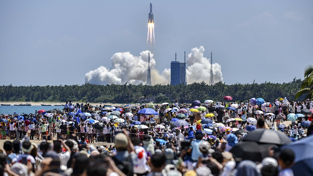 Spectators watch as the Long March-5B Y3 carrier rocket blasts off from the Wenchang Spacecraft Launch Site on the coast of south China's Hainan Province, July 24, 2022. /CFP