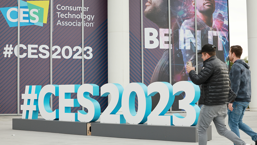 People walk past a sign for the 2023 Consumer Electronics Show in Las Vegas, U.S., January 2, 2023. /CFP