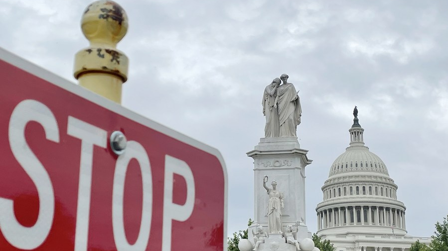 The U.S. Capitol building behind a traffic sign in Washington, D.C., the United States, May 28, 2021. /Xinhua
