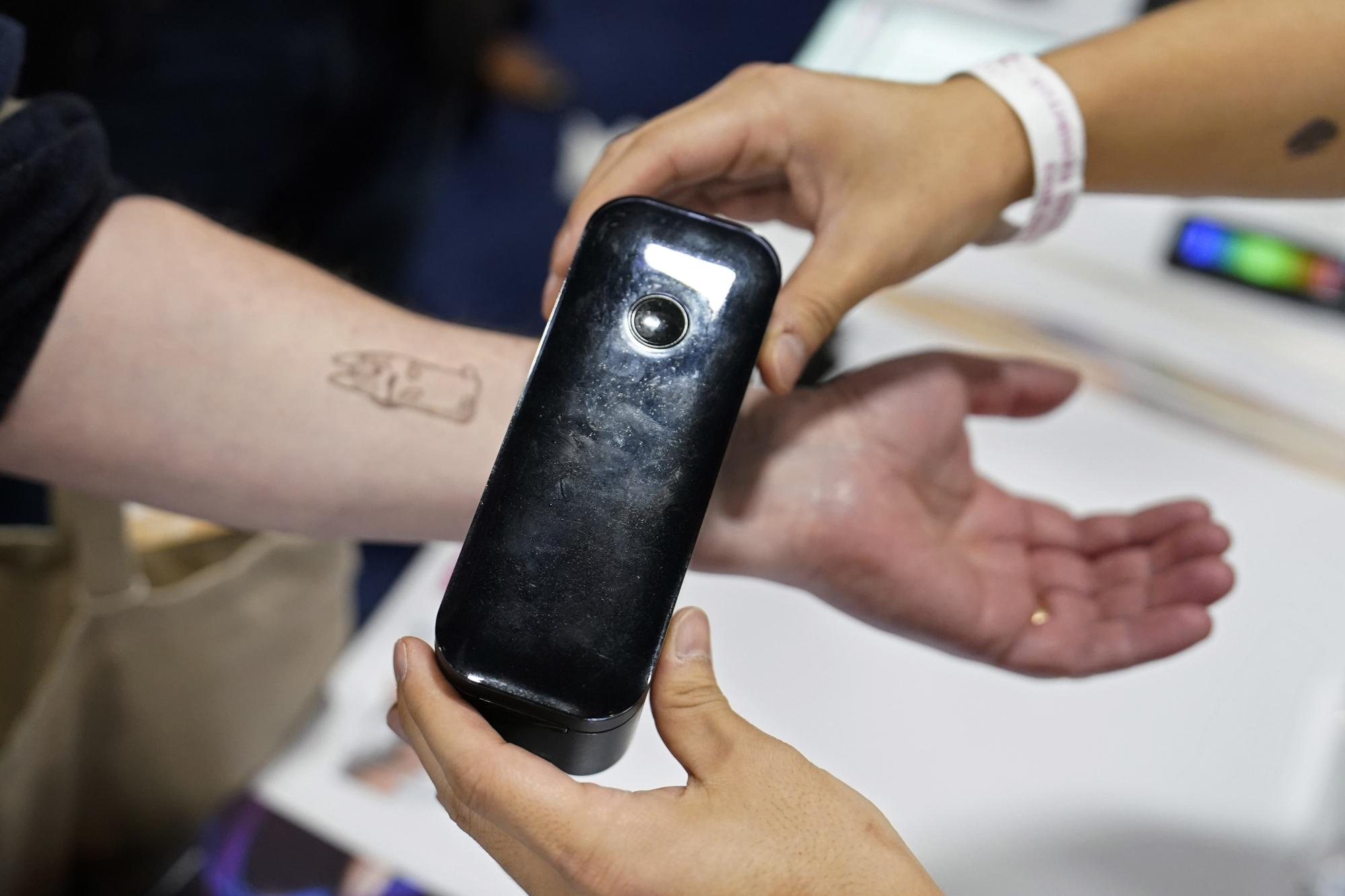 A temporary tattoo with a Prinker digital temporary tattoo device during CES Unveiled. /AP