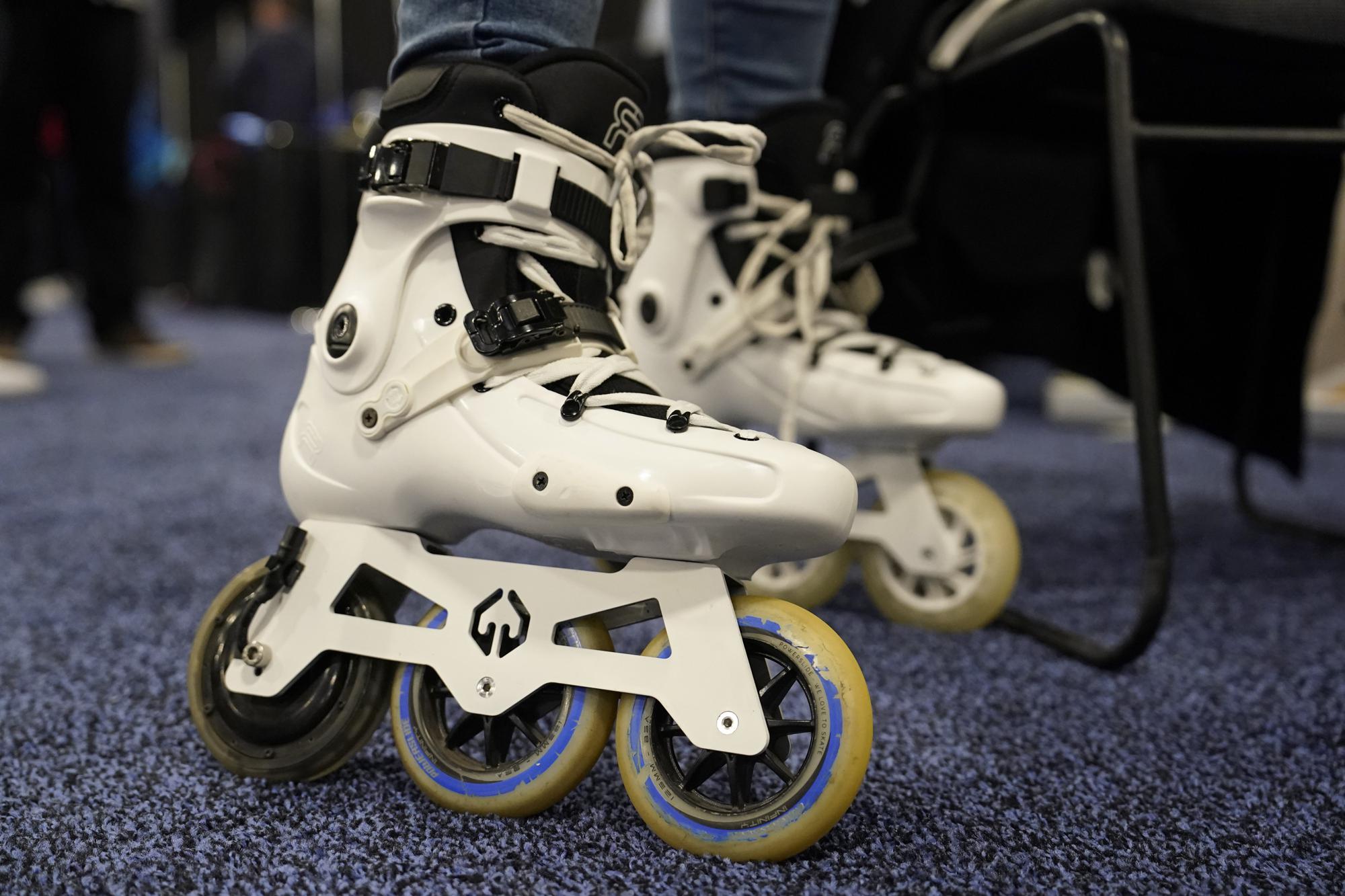 Mohamed Soliman of Atmos Gear shows off the Atmos Gear inline electric skates during CES Unveiled. /AP