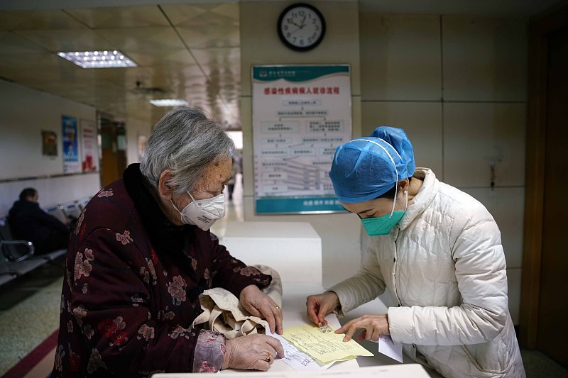 A nurse assists an elderly patient at a hospital in Xi'an City, northwest China's Shaanxi Province, January 4, 2023. /CFP
