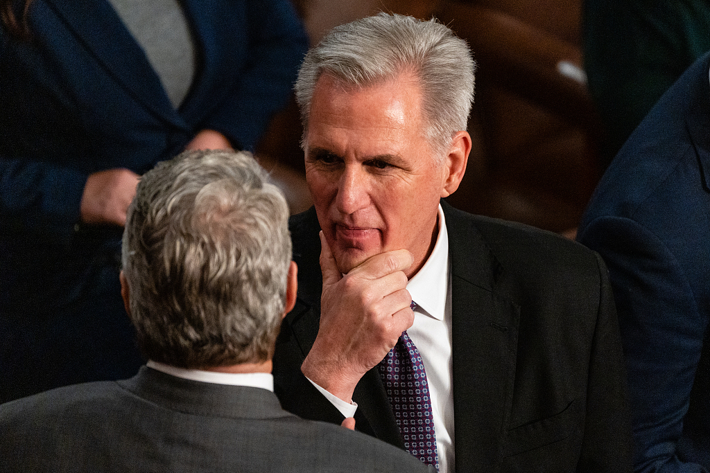 Republican House Representative from California, Kevin McCarthy, talks with a member during a meeting of the 118th Congress in the House Chamber at the U.S. Capitol in Washington, D.C., U.S., January 4, 2023. /CFP