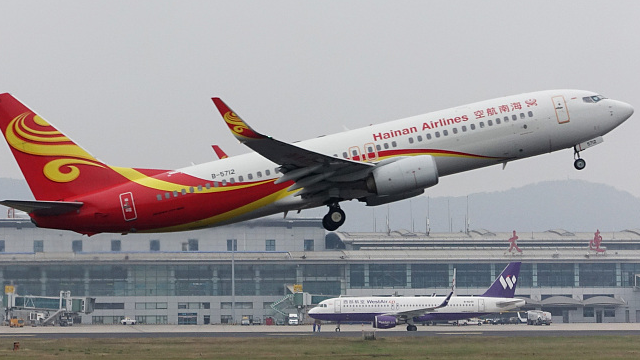 A civil airliner takes off from Dalian Airport in Dalian, northeast China's Liaoning Province, October 10, 2019. /CFP