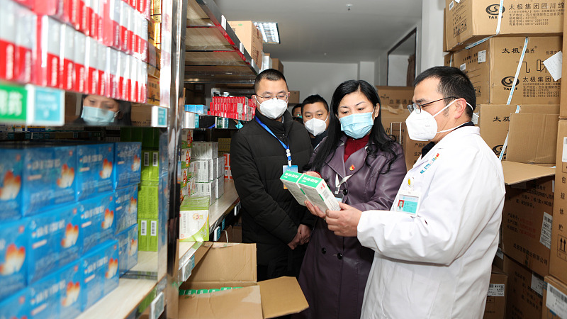 Inspectors check the storage of drugs at a clinic in Handong Village, Zhutuo Town Health Center, southwest China's Chongqing Municipality, January 4, 2023. /CFP