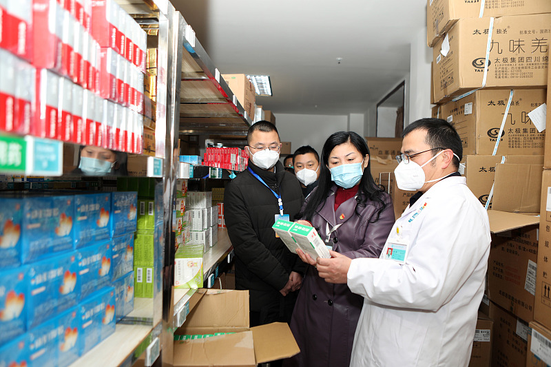 Inspectors check the storage of drugs at the clinic of Handong Village, Zhutuo Town Health Center, Chongqing, January 4, 2023. /CFP