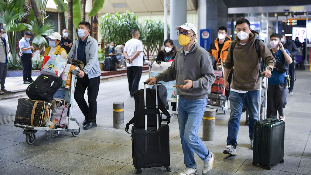 Travelers at Meilan International Airport in Haikou, south China's Hainan Province, December 9, 2022. /CFP