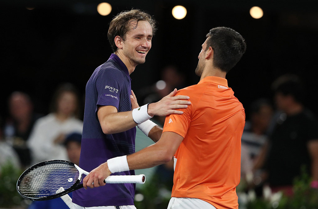 Daniil Medvedev (L) and Novak Djokovic greet each other after the match at the 2023 Adelaide International in Adelaide, Australia, January 7, 2023. /CFP