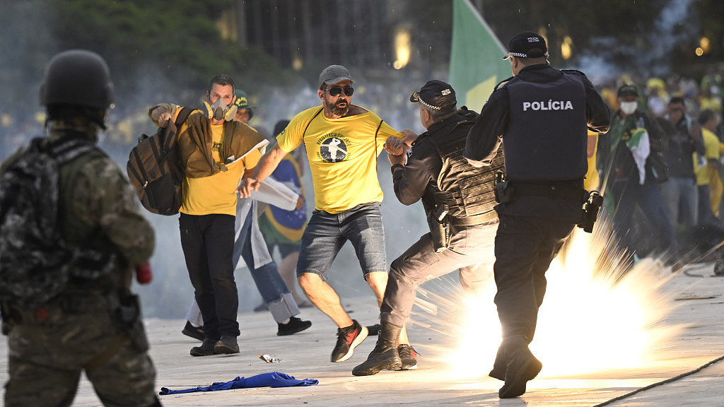 Supporters of former President Jair Bolsonaro clash with security forces as they raid the National Congress in Brasilia, Brazil, January 8, 2023. /CFP
