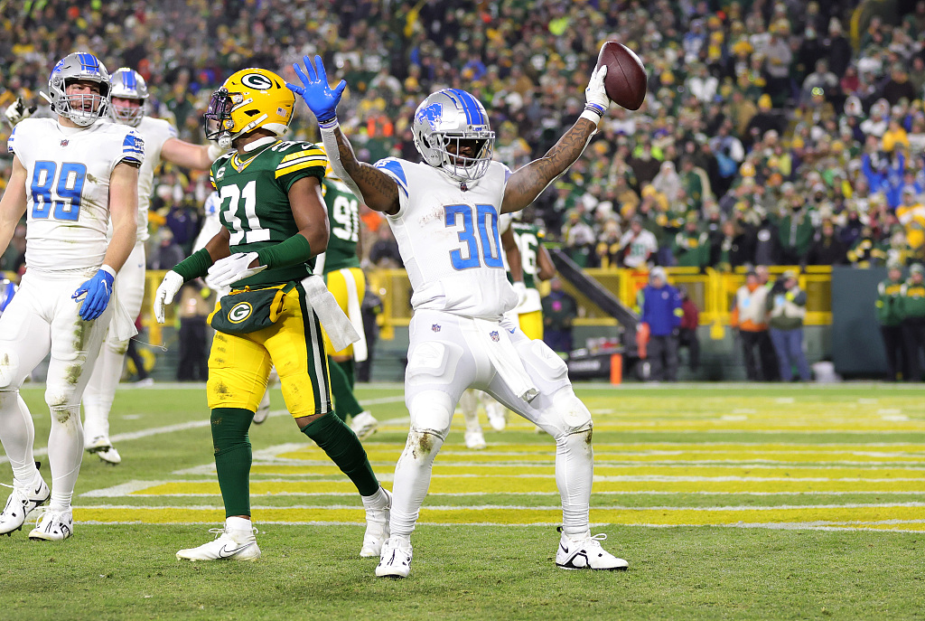 Running back Jamaal Williams (#30) of the Detroit Lions celebrates after scoring a touchdown in the game against the Green Bay Packers at Lambeau Field in Green Bay, Wisconsin, January 8, 2023. /CFP
