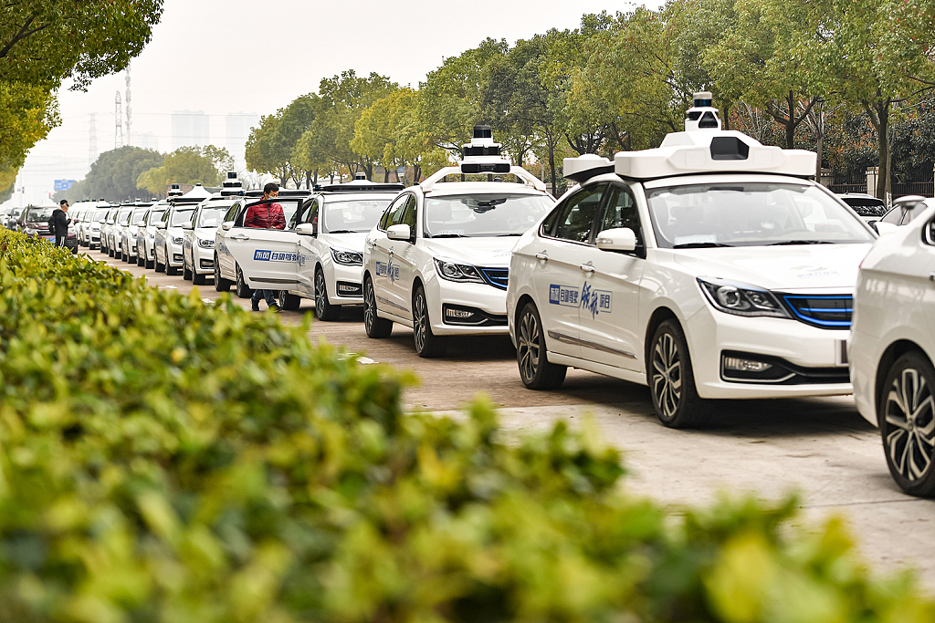 A fleet of robotaxis parks on a road in Wuhan, central China's Hubei Province, February 27, 2021. /CFP
