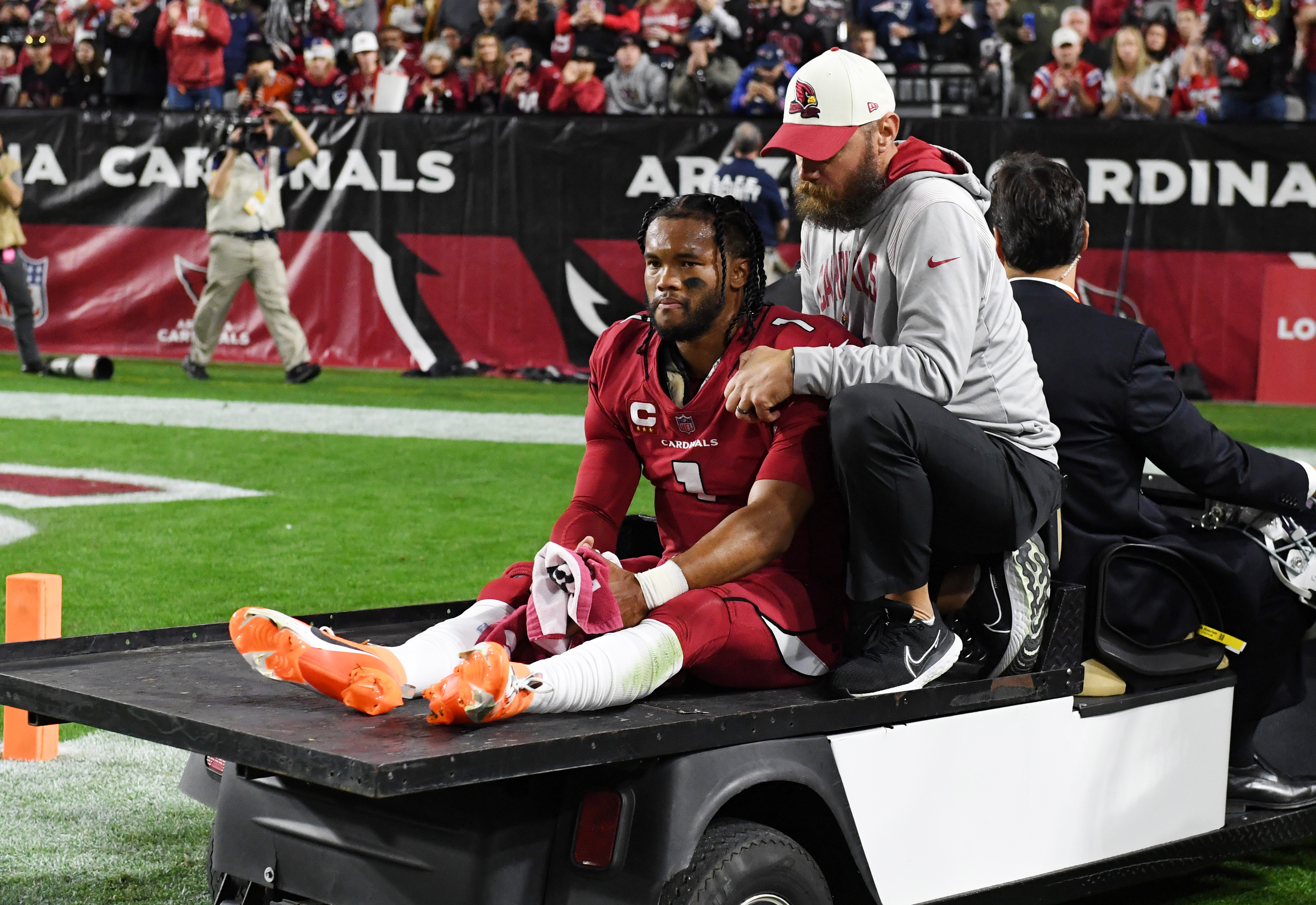 Quarterback Kyler Murray (#1) of the Arizona Cardinals is carted off the field during the game against the New England Patriots at the State Farm Stadium in Glendale, Arizona, December 12, 2022. /CFP 
