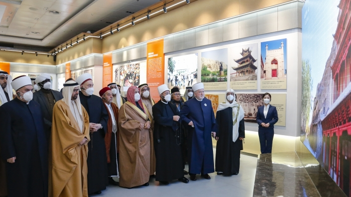Islam experts and scholars at an exhibition in the Xinjiang International Convention and Exhibition Center, Urumqi, capital of northwest China's Xinjiang Uygur Autonomous Region, January 8, 2023. /Xinjiang Daily