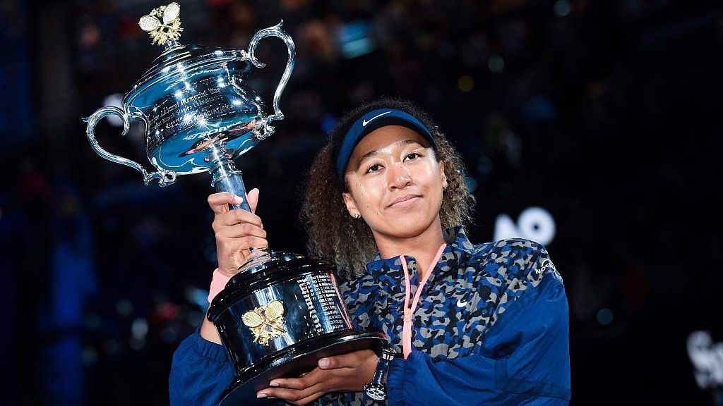 Naomi Osaka poses with the trophy after defeating Jennifer Brady in their women's singles final match at the Australian Open tennis tournament in Melbourne, Australia, February 20, 2021. /CFP