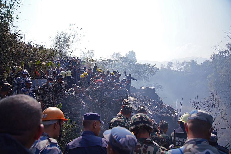 Rescuers gather at the site of a plane crash in Pokhara, Nepal, January 15, 2023. /CFP