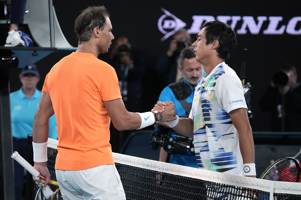 Rafael Nadal (L) of Spain congratulates Mackenzie McDonald of the U.S., following their men's singles match at the Australian Open at Melbourne Park in Melbourne, Australia, January 18, 2023. /CFP