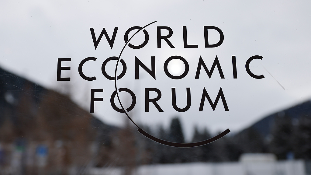The logo of the World Economic Forum (WEF) on a window inside the Congress Center in Davos, Switzerland, January 16, 2023. /CFP