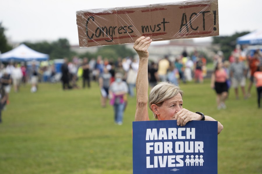 People gather during a rally decrying rising gun violence while urging politicians to take action in Washington, D.C., the United States, June 11, 2022. /Xinhua
