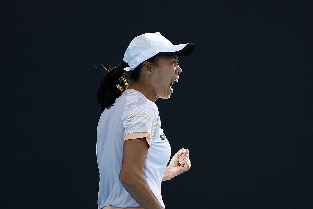 Zhang celebrates in the women's singles second round match against Petra Martic of Croatia at the Australian Open, January 19, 2023. /CFP