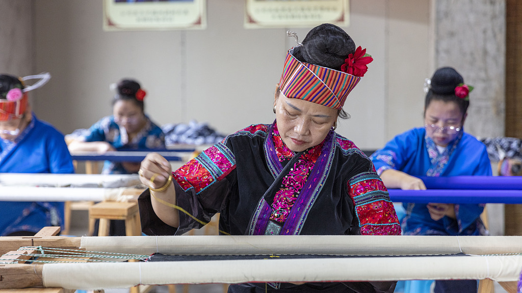 Women embroiderers can be seen embroidering Miao products at the poverty-alleviation workshop in Shibing county, Guizhou province, China, September 23, 2022. /CFP