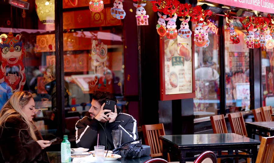 People dine at a restaurant in Chinatown in London, the United Kingdom, January 20, 2023. /Xinhua