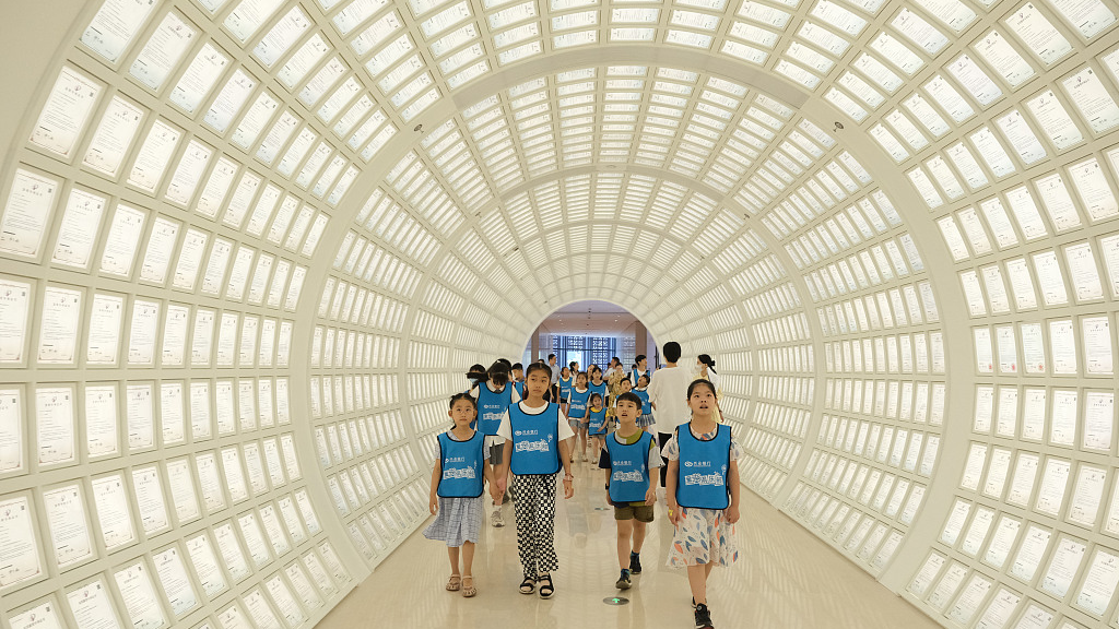 People visit the Fangtai Patent Tunnel with more than 8,000 national patent certificates, in Ningbo, east China's Zhejiang Province, August 18, 2022. /CFP