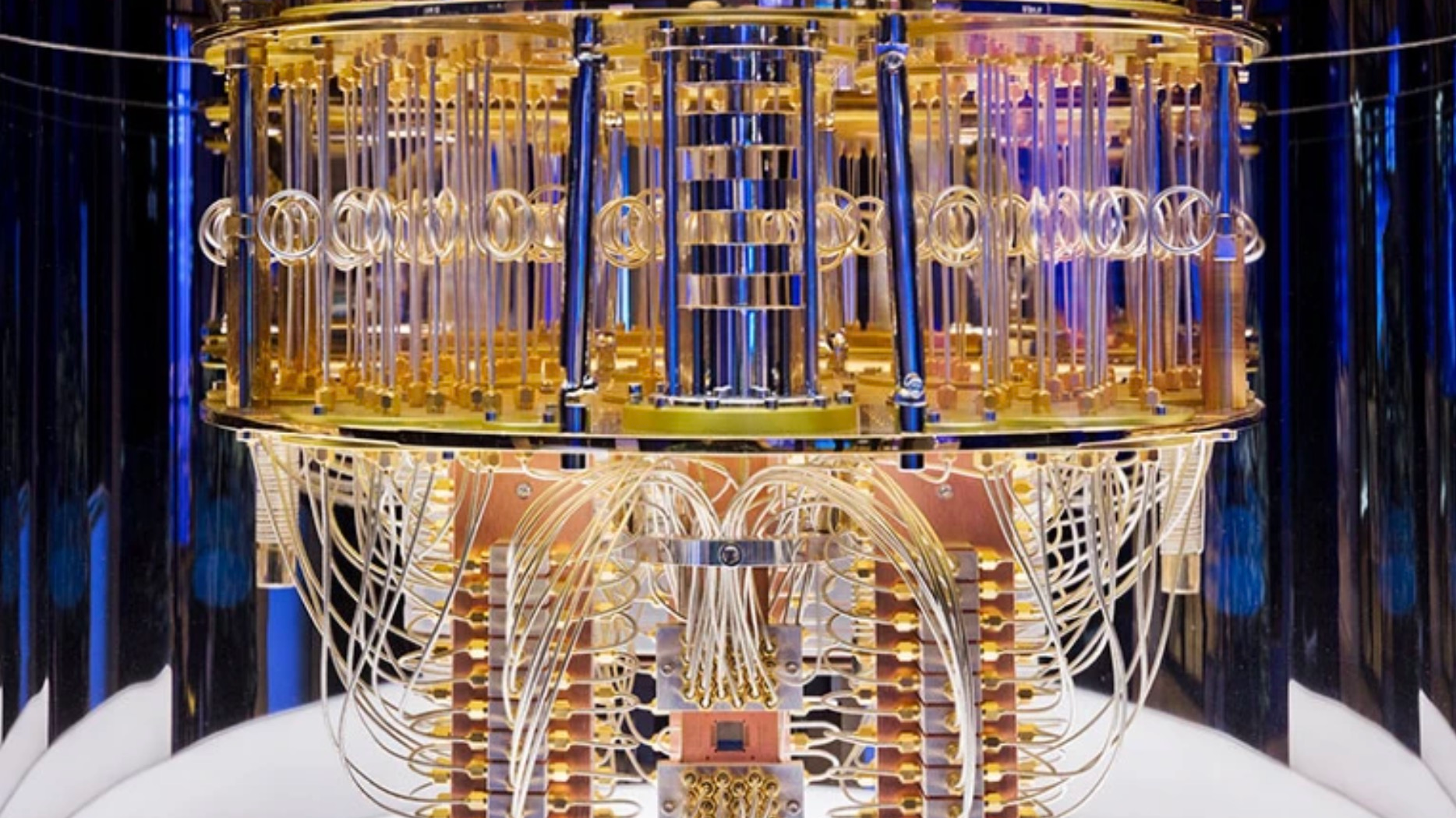 The innards of an IBM quantum computer show the tangle of cables used to control and read out its qubits. /IBM