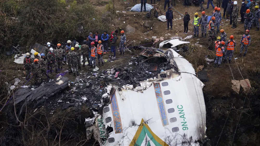 Rescuers scour the crash site of a passenger plane in Pokhara, Nepal, January 16, 2023. /AP