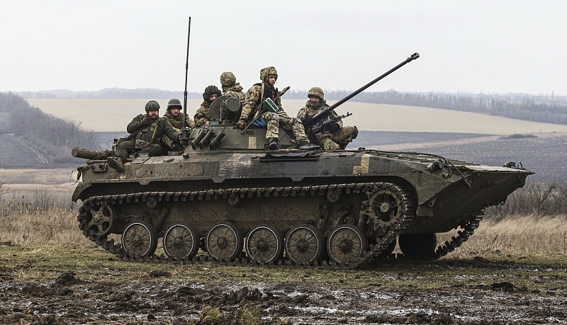 Ukrainian soldiers sit atop an APC during combat training in Zaporizhzhia region, Ukraine, Tuesday, January 24, 2023. /CFP