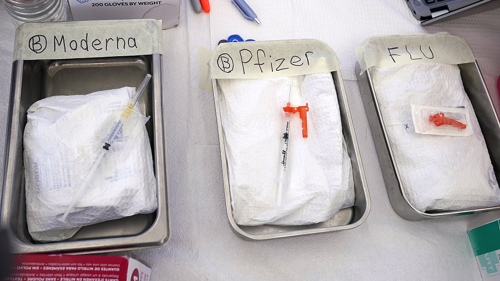 Syringes with vaccines for flu and COVID-19 are prepared at the L.A. Care and Blue Shield of California Promise Health Plans' Community Resource Center in Lynwood, California, October 28, 2022. /CFP