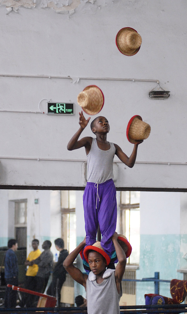 Boys from Tanzania hone their acrobatic skills at the Wuqiao Acrobatic Art School in Hebei. /CFP
