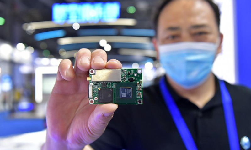 An exhibitor shows a module with an anti-jamming chip during the 12th China Satellite Navigation Expo (CSNE) in Nanchang, capital of east China's Jiangxi Province, May 27, 2021. /Xinhua