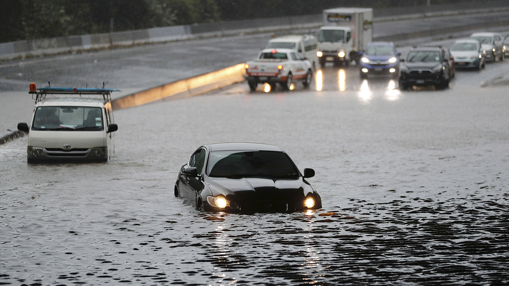 Vehicles are stranded by flood water in Auckland on Saturday, January 28, 2023. Record levels of rainfall pounded New Zealand's largest city, causing widespread disruption. /CFP