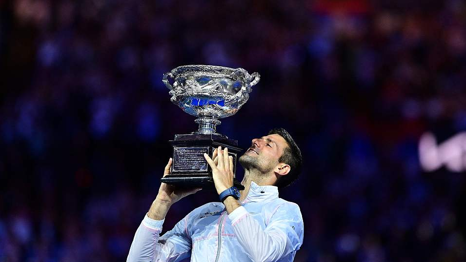 Novak Djokovic celebrates with his trophy after winning the Australian Open men's singles final in Melbourne, Australia, January 29, 2023. /CFP