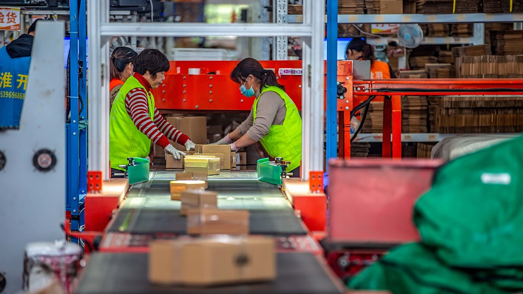 Workers at an e-commerce enterprise pack delivery packages for Double Eleven, China's biggest annual online shopping festival, Huai'an, Jiangsu Province, China, November 11, 2022. /CFP