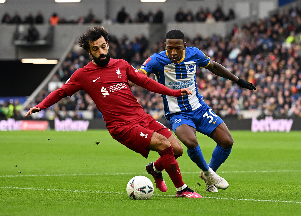 Mohamed Salah (L) of Liverpool battles for the ball during the FA Cup game against Brighton & Hove Albion in Brighton, UK, January 29, 2023. /CFP