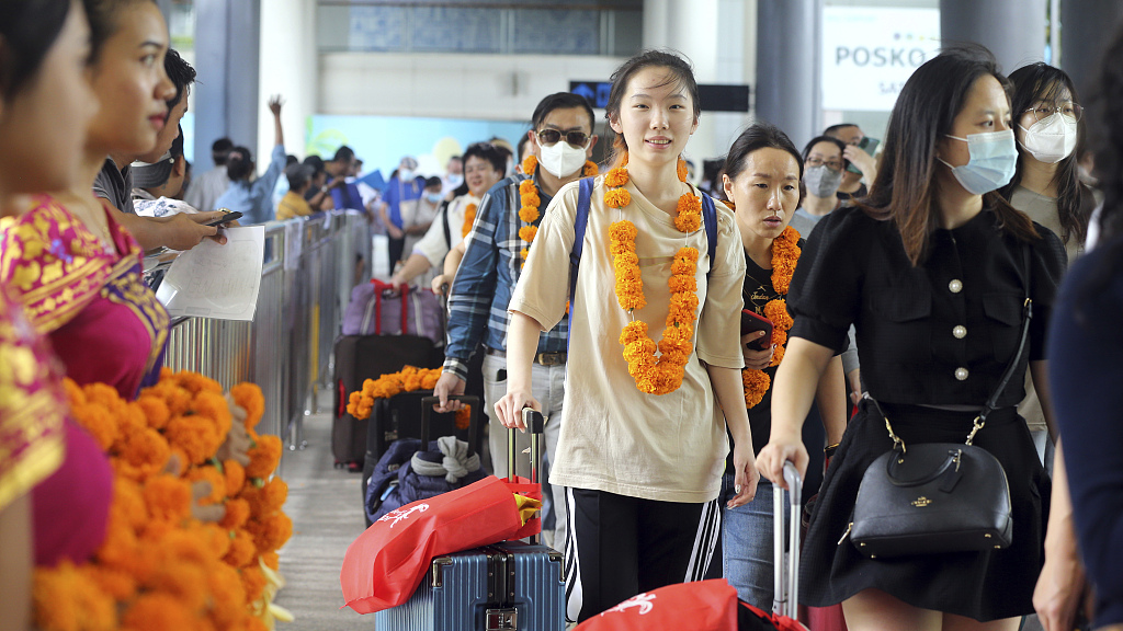 Chinese tourists arrive at Ngurah Rai international airport in Bali, Indonesia, January 22, 2023. /CFP