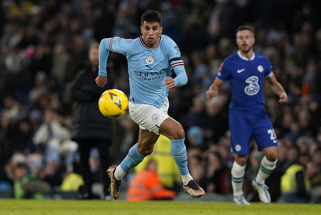 Joao Cancelo of Manchester City (C) drives in the FA Cup game against Chelsea at the Etihad Stadium in Manchester, England, January 8, 2023. /CFP 