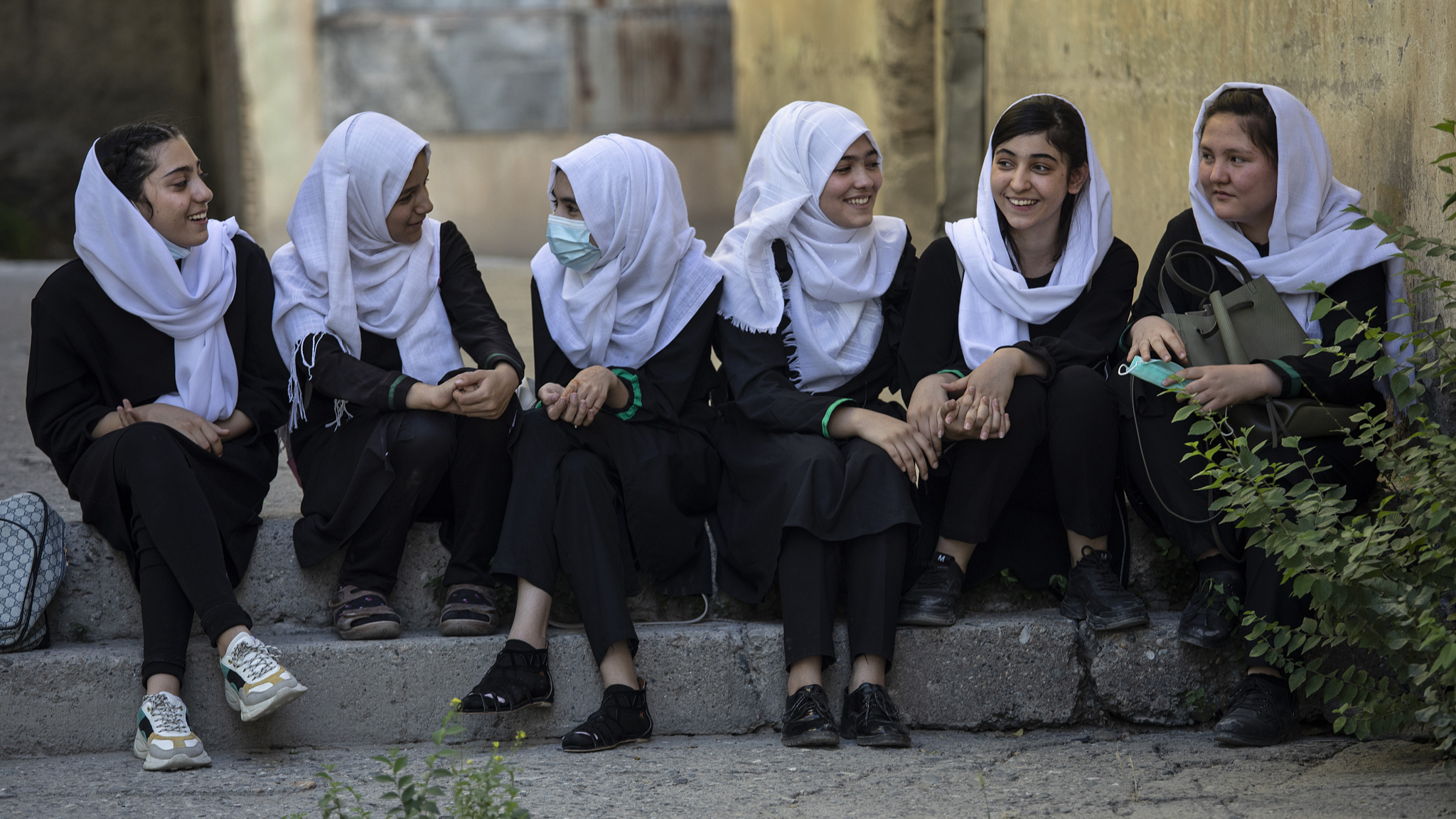 Afghan female students talk after school in Kabul, Afghanistan, July 24, 2021. /CFP