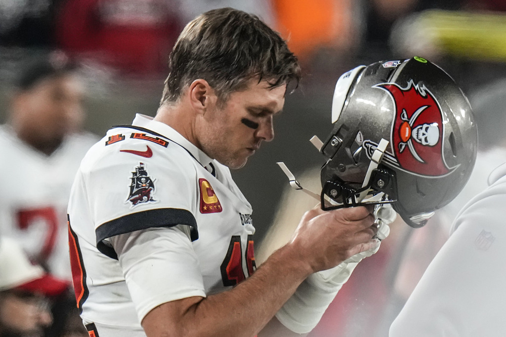 Quarterback Tom Brady of the Tampa Bay Buccaneers takes off his helmet during the NFL National Football Conference Wild Card Game against the Dallas Cowboys at Raymond James Stadium in Tampa, Florida, January 16, 2023. /CFP