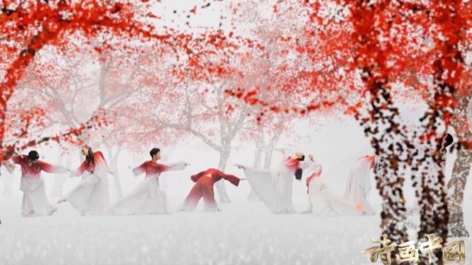 Xie Xin and her partners dance in red silk. /CGTN